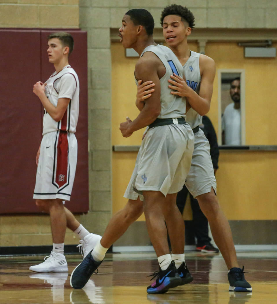 Canyon SpringsՠKevin Legardy (4), second from right, and teammate Kayvon Alexander (11 ...