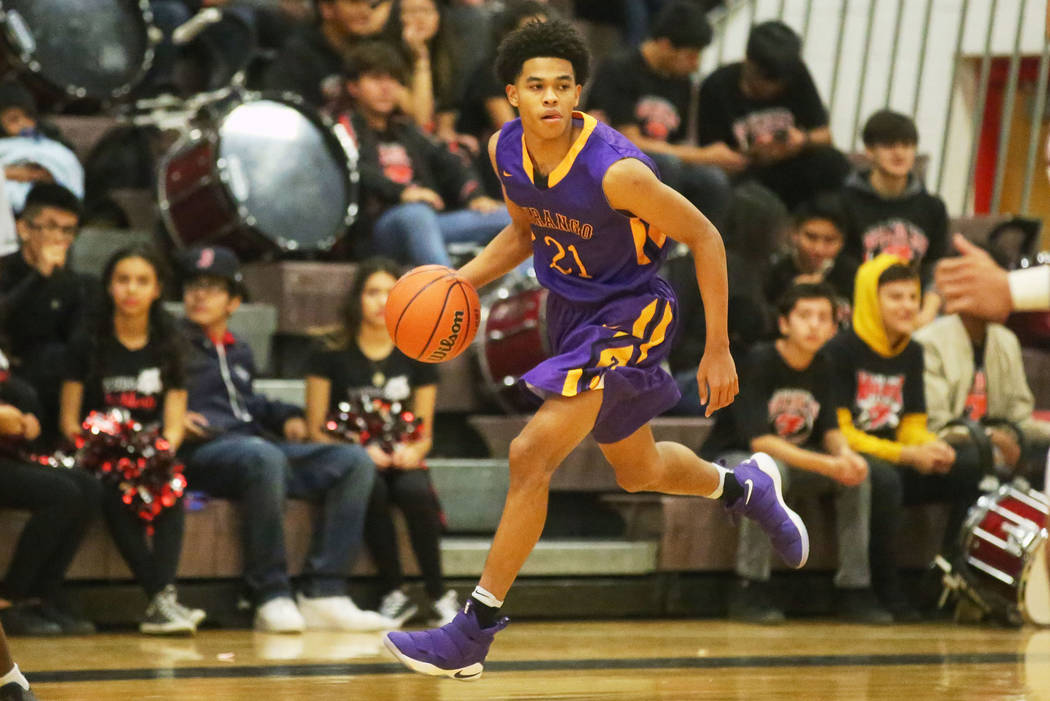 Durango player Anthony Hunter (21) brings the ball up the court during a game against Las Ve ...