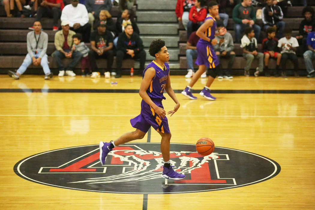 Durango player Anthony Hunter (21) brings the ball up the court during a game against Las Ve ...