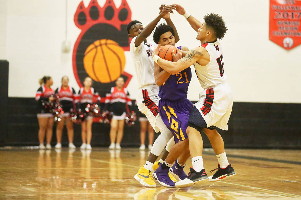 Durango player Anthony Hunter (21) fights to keep possession of the ball during a game again ...