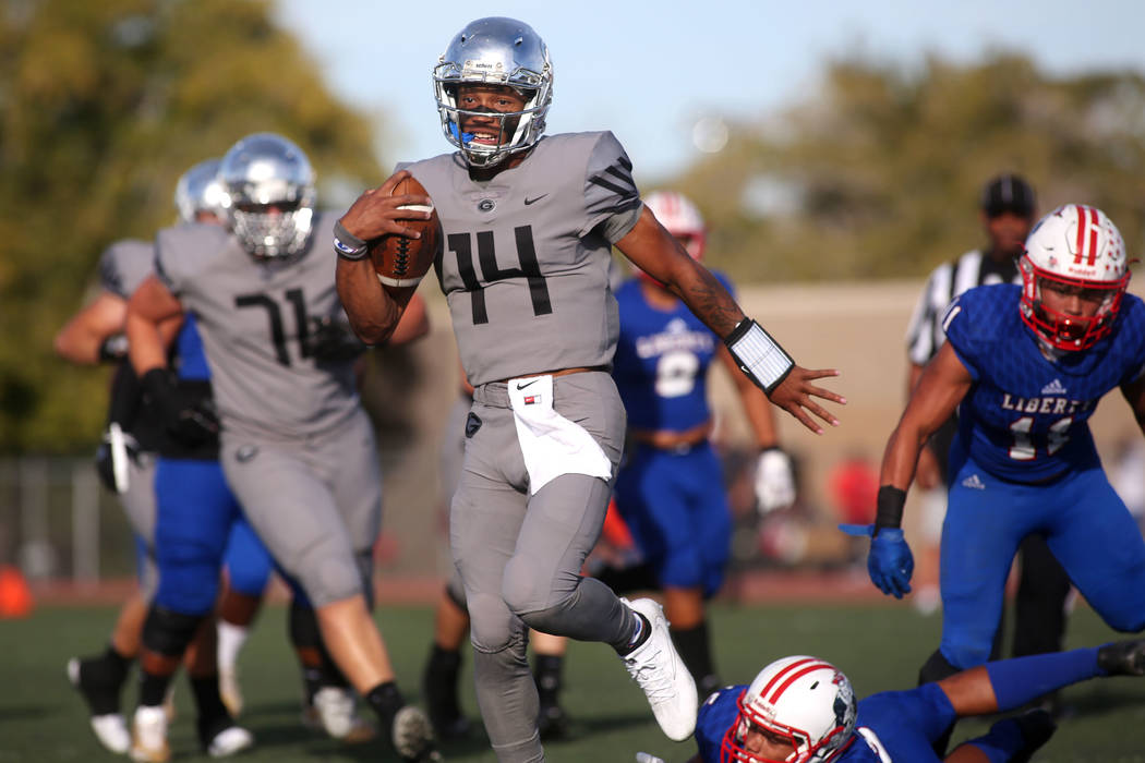 Dorian Thompson-Robinson (14) runs the ball to the end zone during the class 4A state semifi ...