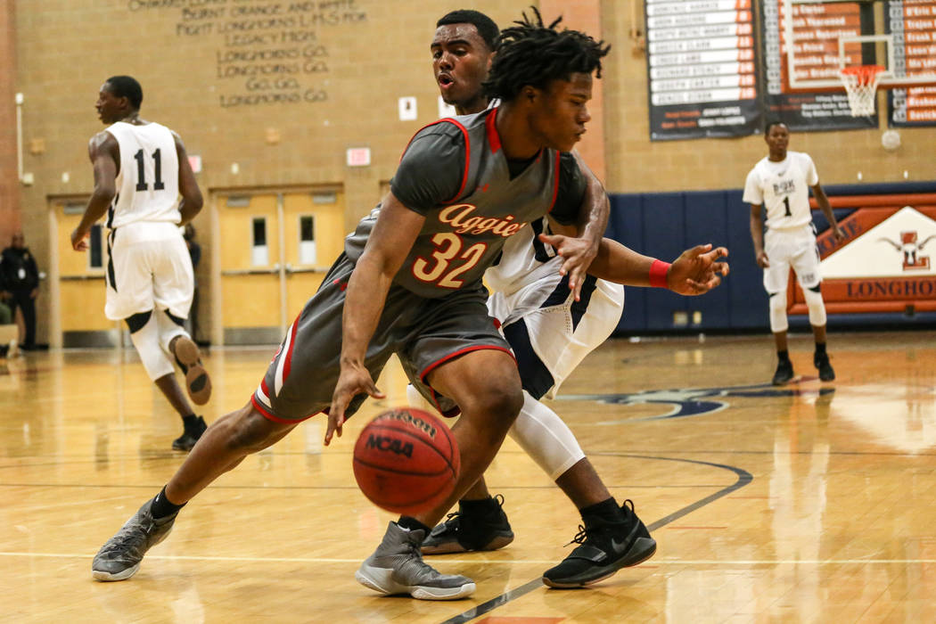 Arbor View’s Jeremiah Wade (32), left, is guarded by Democracy Prep’s Daniel Plu ...
