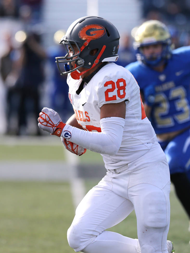 Bishop Gorman’s Amod Cianelli runs against Reed in the NIAA 4A state championship foo ...