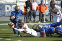 Bishop Gorman’s Amod Cianelli dives for the goal line during the first half of the NI ...
