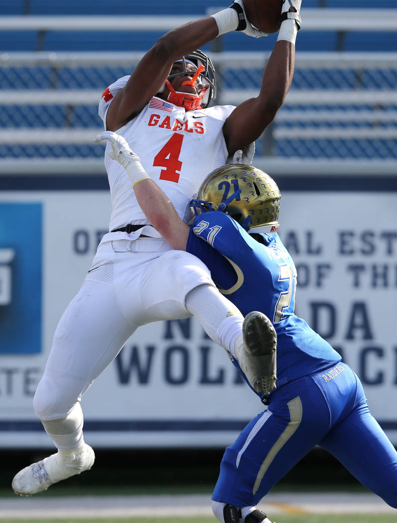 Bishop Gorman’s Cedric Tillman goes up for a reception against Reed’s Chase Me ...