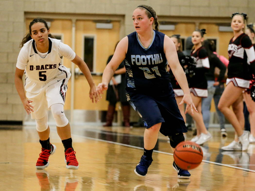 Desert Oasis’ Eliyjah Pricebrooks (5), left, chases after Foothill’s Rhianna Cox ...
