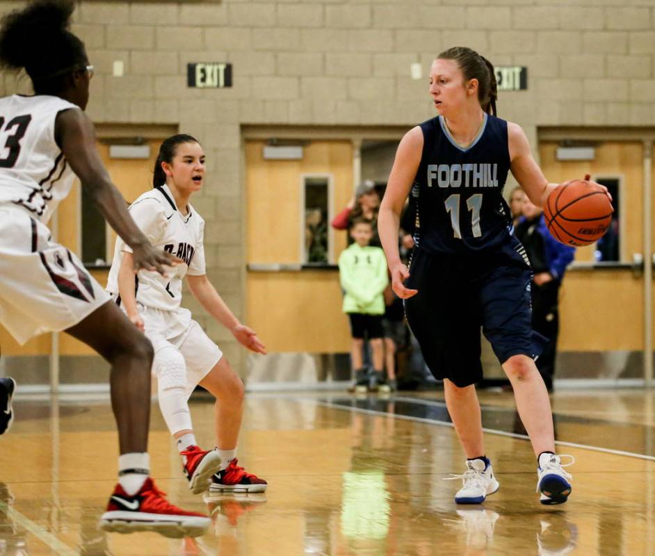Foothill’s Kaylee Hall (11), right, dribbles the ball as she is guarded by Desert Oasi ...