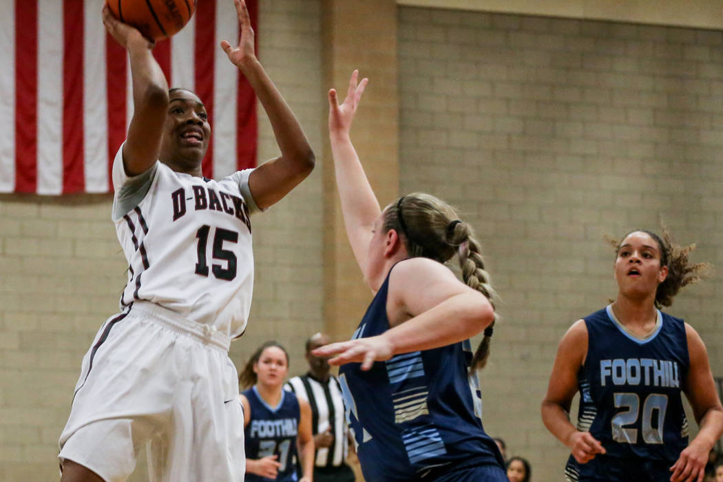 Desert Oasis’ Ahmaya Smith (15), left, shoots the ball against Foothill during the sec ...
