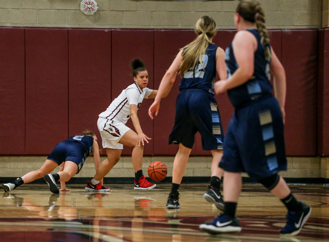 Desert Oasis’ Dajaah Lightfoot (35), second from left, dribbles the ball against Footh ...