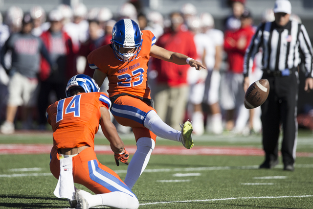 Bishop Gorman’s Derek Ng (23) kicks the ball for an extra point against Liberty in the ...