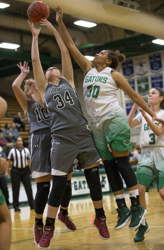 Faith Lutheran’s Ellery Wilson (10) and Kelsey Howryla (34) and Green Valley’s S ...