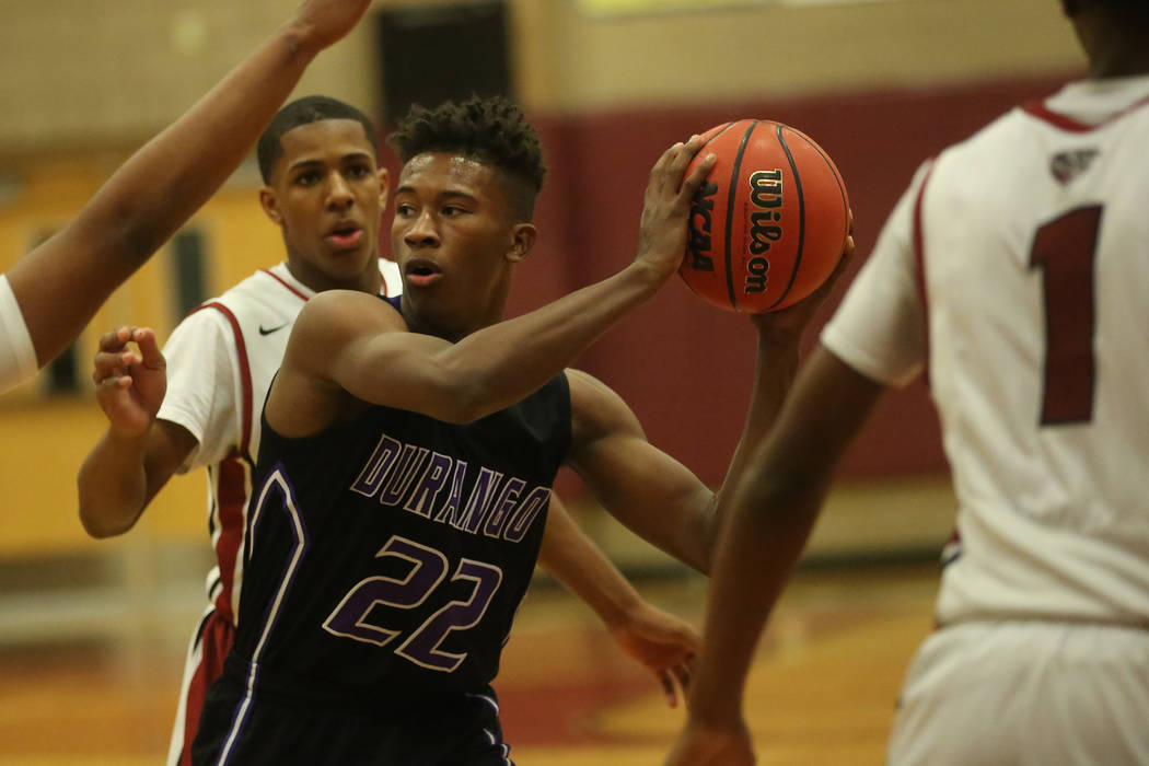 Durango player Vernell Watts (22) looks for a teammate to pass to during a game against Dese ...