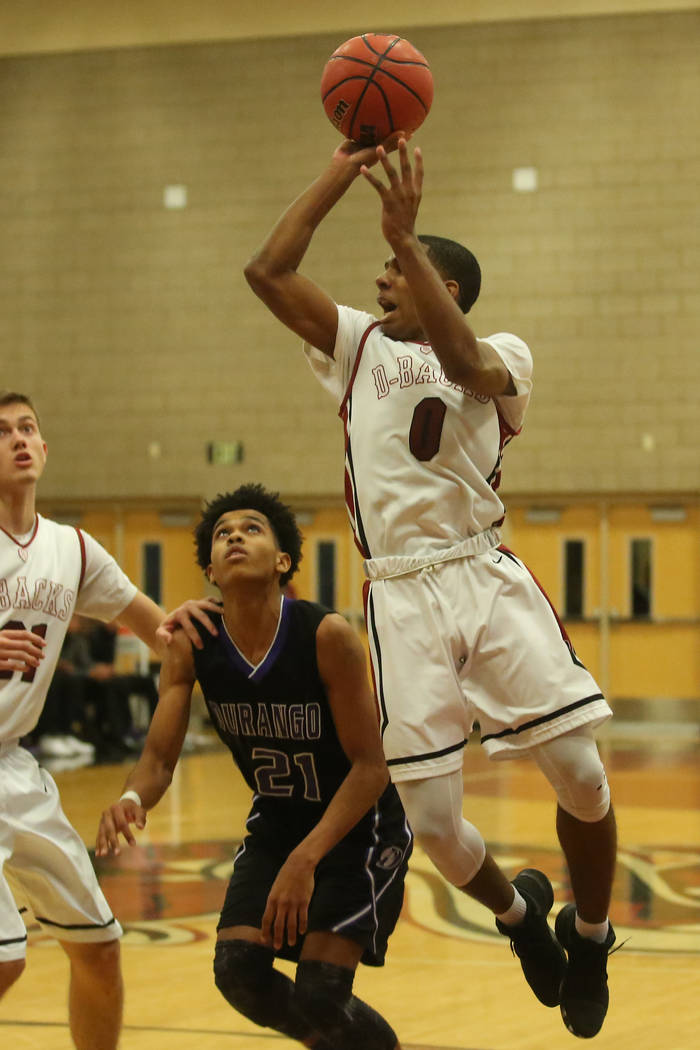 Desert Oasis player Kamari Burnside (0) attempts a shot during a game against Durango at Des ...