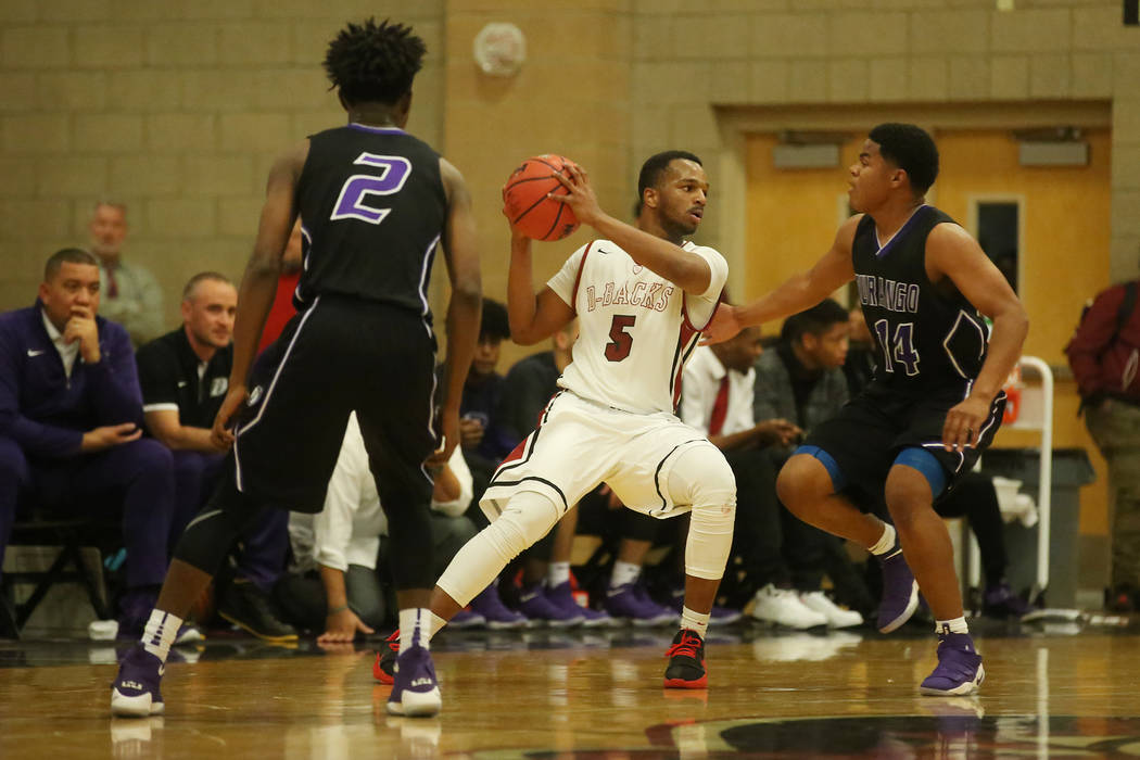 Desert Oasis player Manny Mitchell (5) looks for a pass during a game against Durango at Des ...