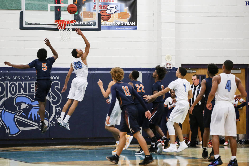 Canyon Springs’ KaeJon Barnes (20), second from left, scores against Legacy’s Ch ...