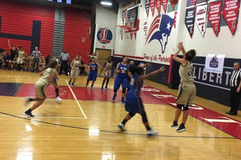 Spring Valley’s Essence Booker shoots a 3-pointer during the Tarkanian Classic at Libe ...