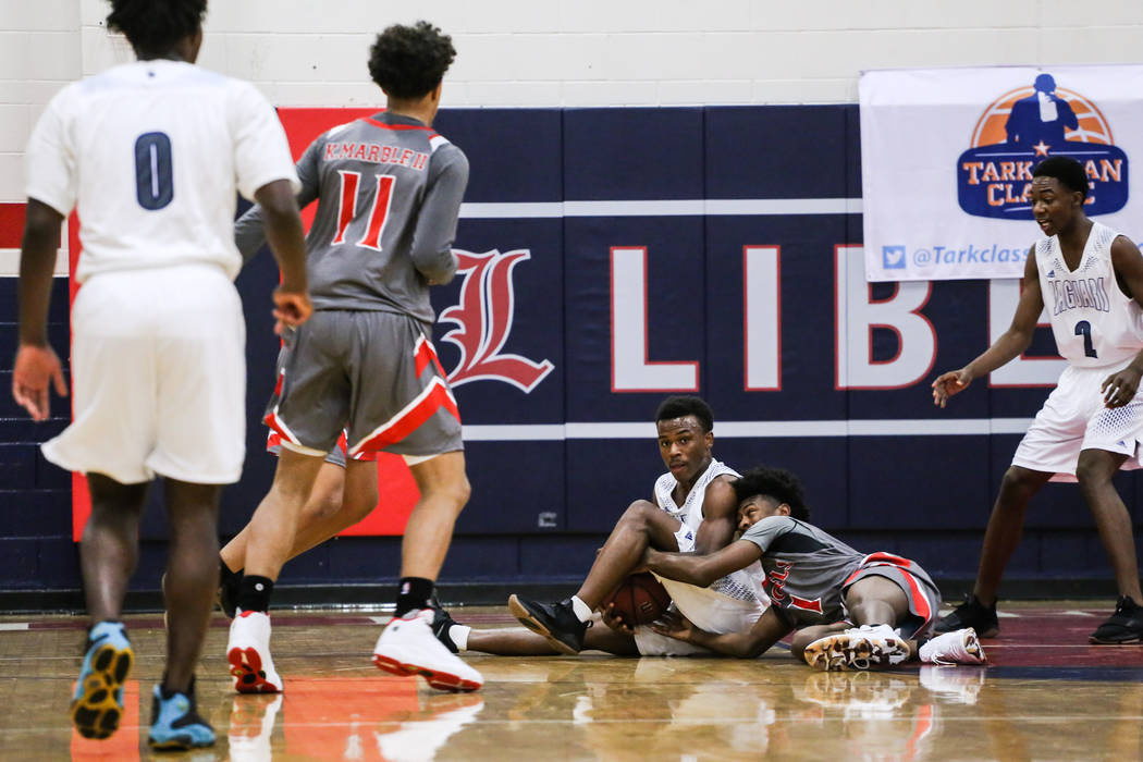 Desert Pines’ Donovan Word (23), left, and Denver East’s Kaelan Potts (1), right ...