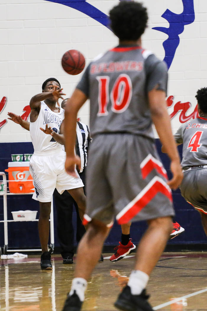 Desert Pines’ Dayshawn Wiley (2) passes the ball to a teammate during the first half o ...