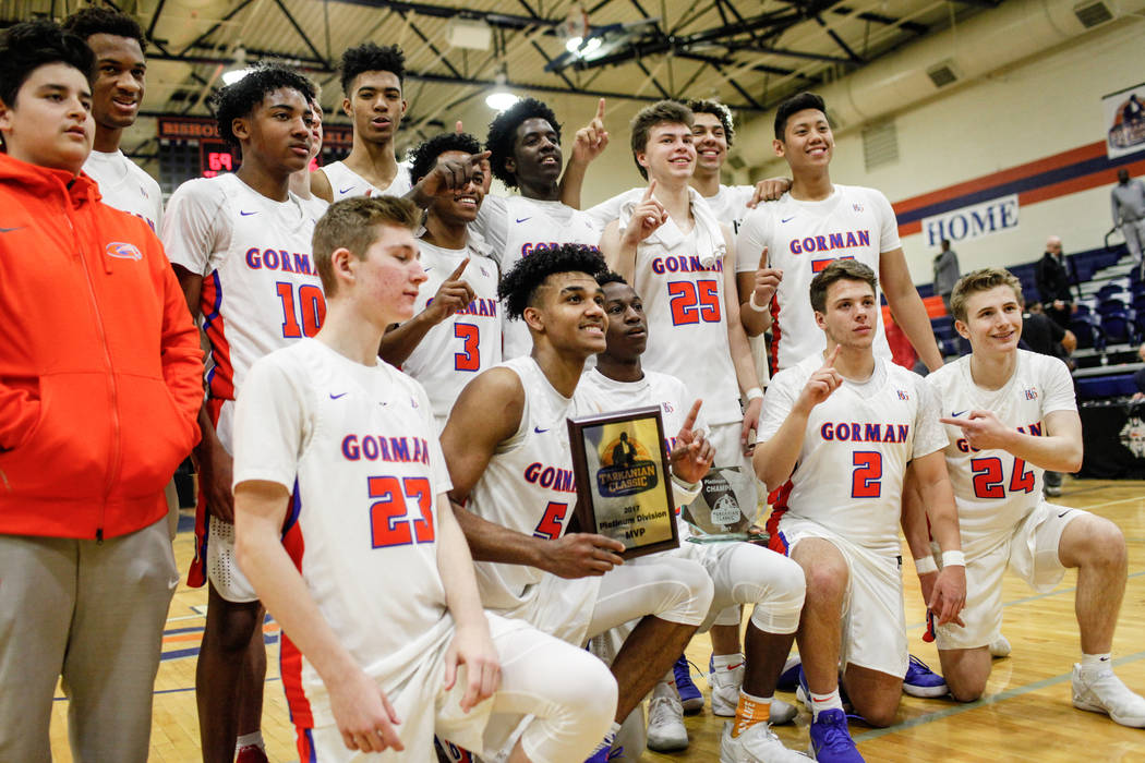 Bishop Gorman holds a trophy after defeating the Clark Chargers 69-56 in the platinum divisi ...