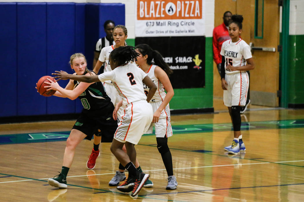 Green Valley’s Julia Clark (10) is guarded by Beverly Hills’ Arbri Gillis (2) du ...