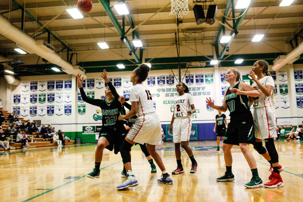 From left to right: Green Valley’s Lusi Soifua (32), Beverly Hills’ Michelle Duc ...