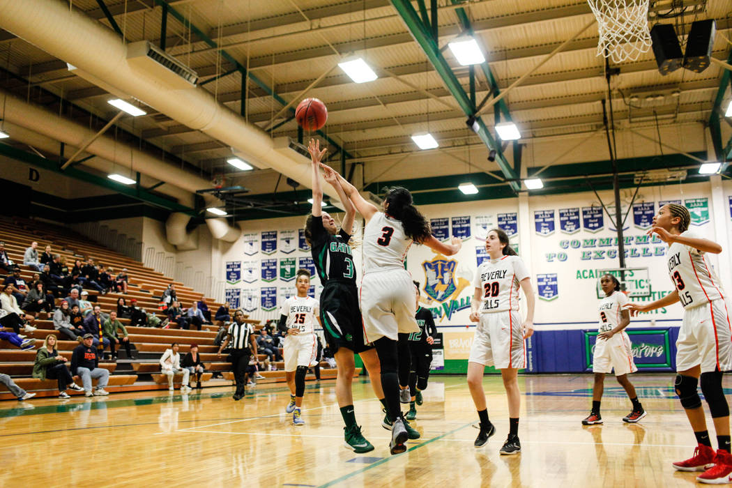 Green Valley’s Temerity Bauer (3) is blocked by Beverly Hills’ Megan Saghian (3) ...