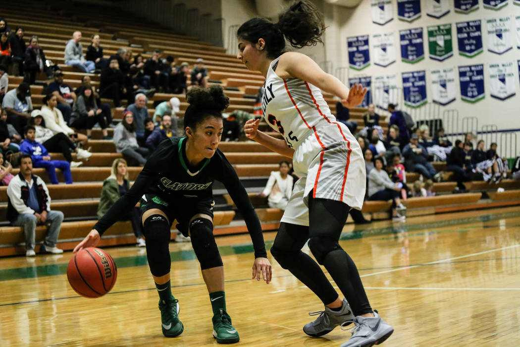 Green Valley’s Rian Anderson (12) dribbles the ball past Beverly Hills’ Megan Sa ...
