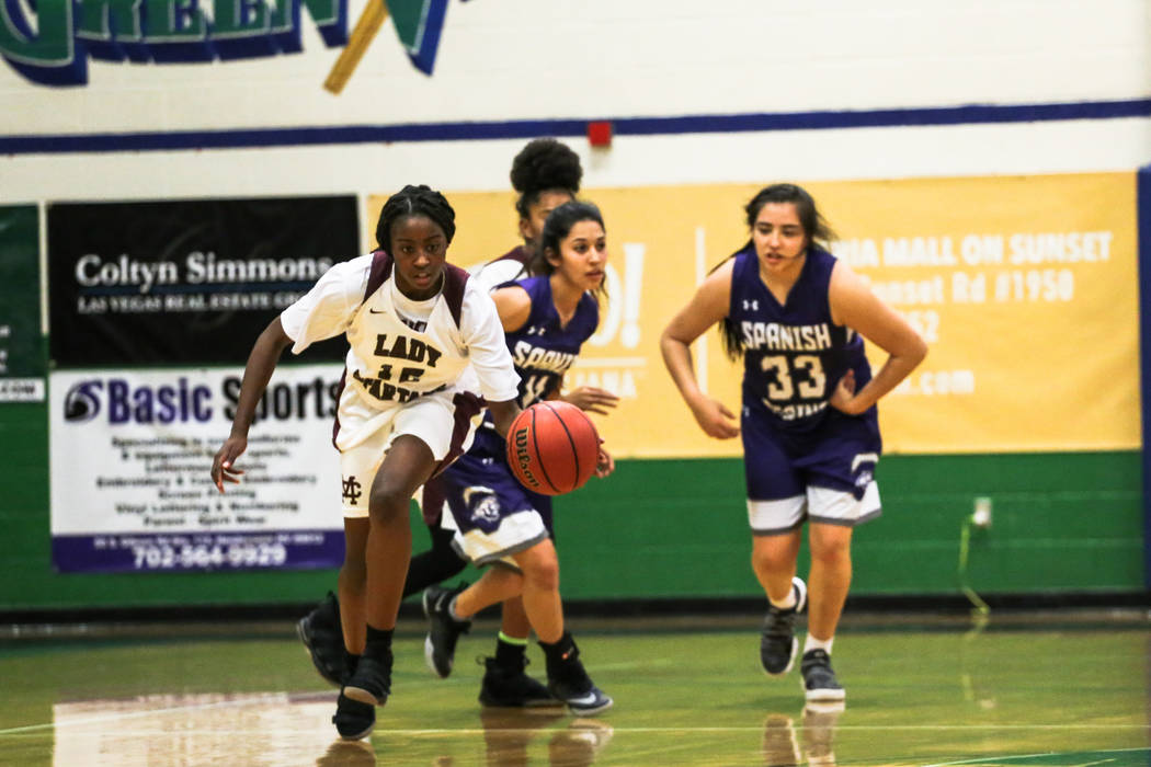 Cimarron-Memorial’s Chynna Torrence (12) dribbles the ball past Spanish Springs’ ...