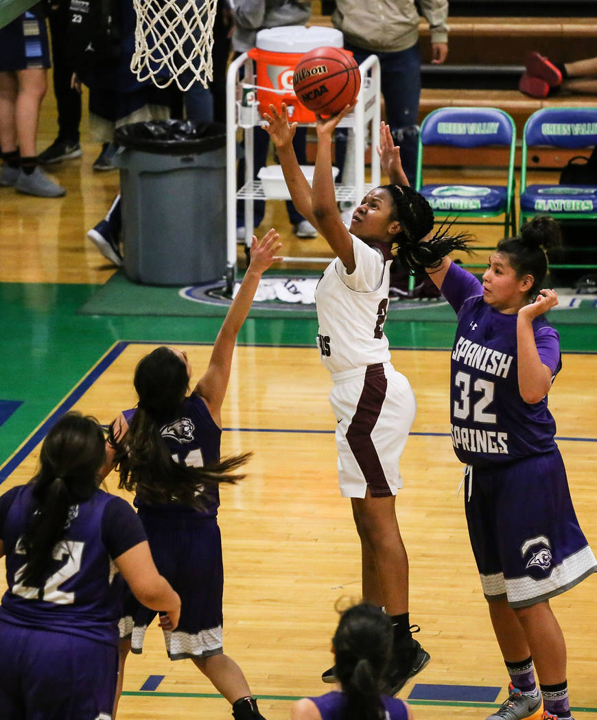 Cimarron-Memorial’s Yesenia Wesley-Nash (24) shoots the ball as she is guarded by Span ...