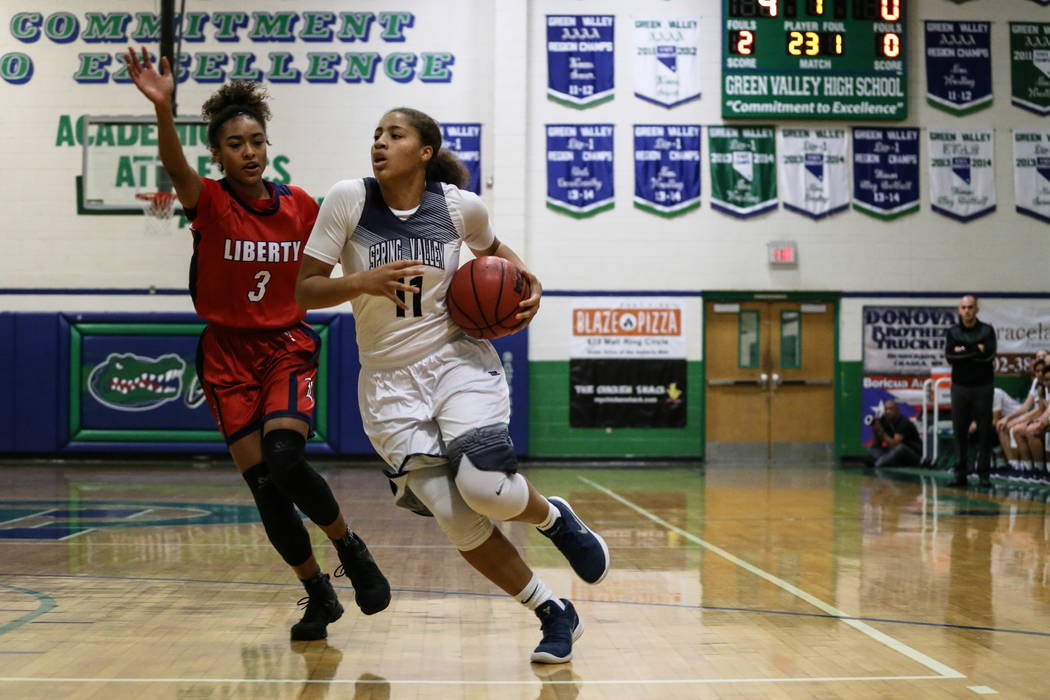 Liberty’s Journie Augmon (3) guards Spring Valley’s Kayla Harris (11) during th ...