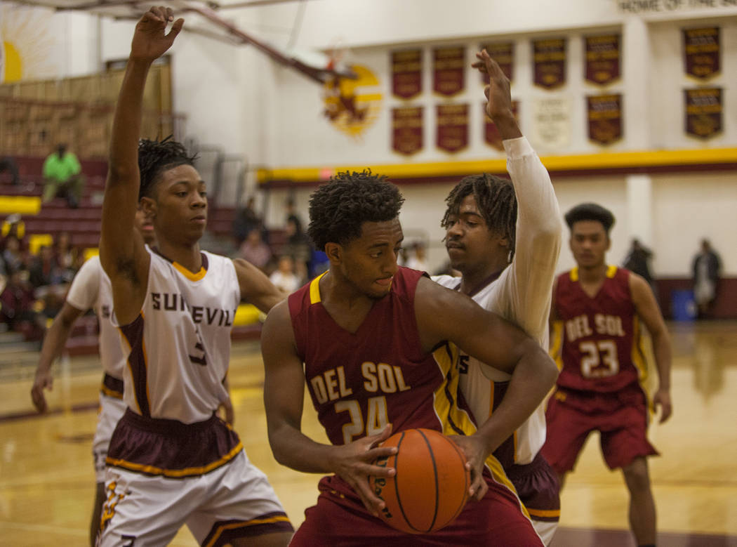 Eldorado’s Jonathan Thomas(3) and Dexter Davis (40) attempt to block Del Sol’s N ...