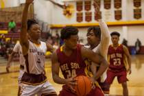 Eldorado’s Jonathan Thomas(3) and Dexter Davis (40) attempt to block Del Sol’s N ...