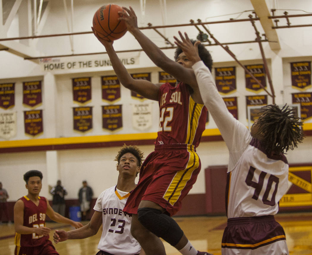 Del Sol’s Keith Seldon (22) attempts to throw a basket against Eldorado’s Kemo B ...