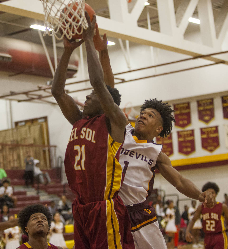 Del Sol’s Maalik Flowers (21) attempt to make a basket against Eldorado’s Patric ...