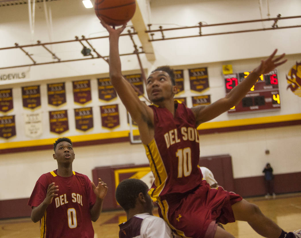 Del Sol’s Tyrell Hampton (0) watches as his teammate Anton Villarta (10) tries to make ...