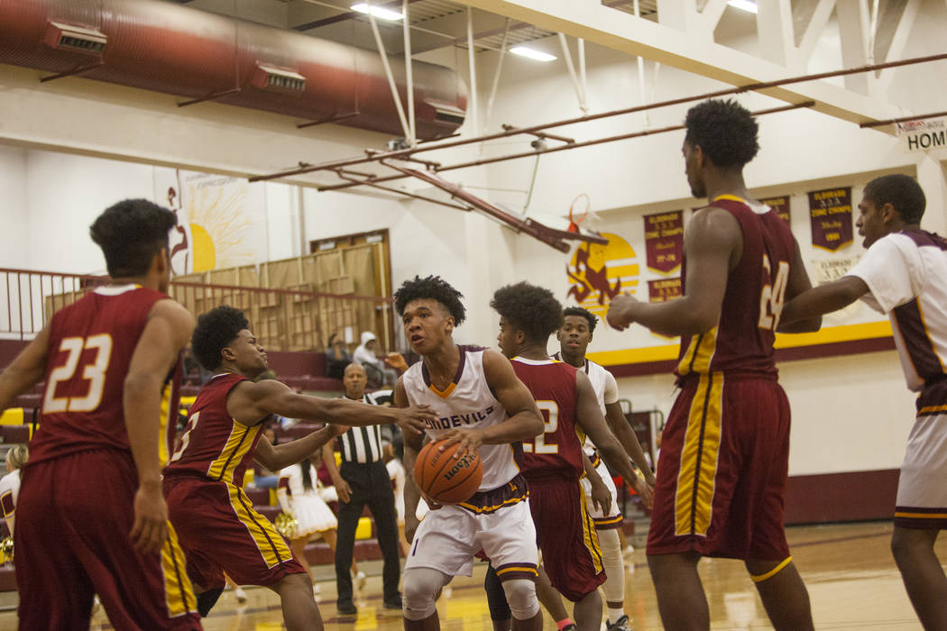 Eldorado’s Patrick Parkes Jr. (1) looks for an opening to shoot the ball in a game aga ...