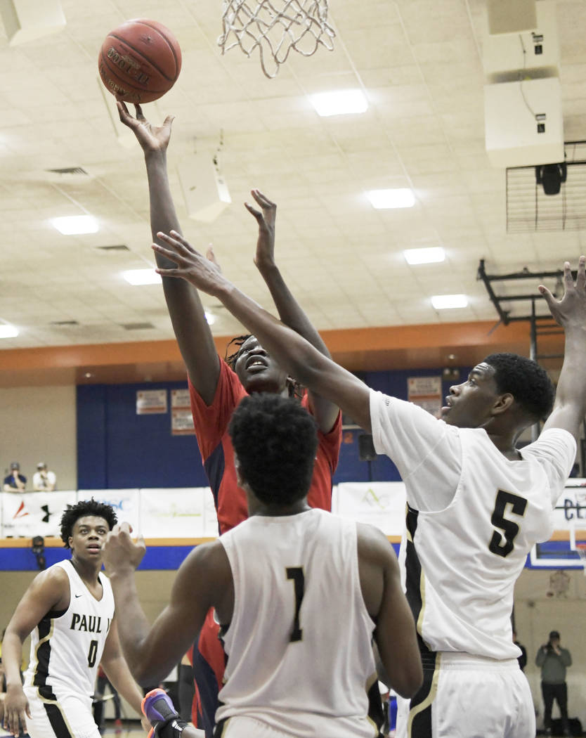 Findlay Prep’s Bol Bol goes to the basket against Paul VI Catholic during the Chick-fi ...