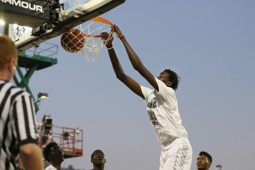 Team Clutch’s Bol Bol #22 in action against Team Drive in the Under Armour Elite 24 g ...