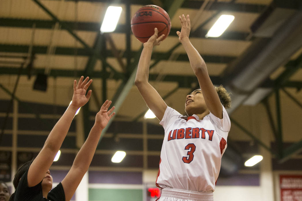 Liberty’s Journie Augmon (3) goes up for a shot against Bonita Vista in the girl&#8217 ...