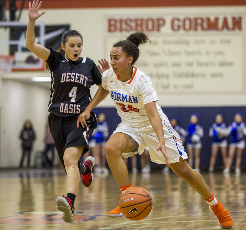 Bishop Gorman’s Bentleigh Hoskins dribbles past Desert Oasis’ Brianna Clark at B ...