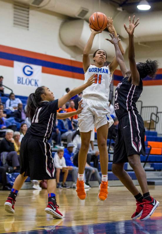 Bishop Gorman’s Olivia Smith attempts to put up a point while Desrert Oasis’ Kal ...