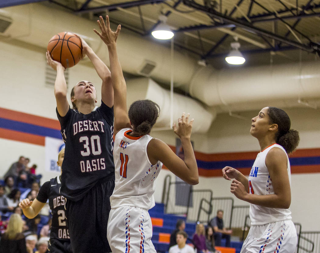 Desert Oasis’ Sierra Mich’l looks for a shot while Bishop Gorman’s Olivia ...