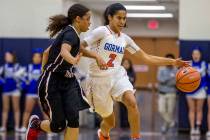 Bishop Gorman’s Shaira Young dribbles around Desert Oasis’ Eliyjah Pricebrooks a ...