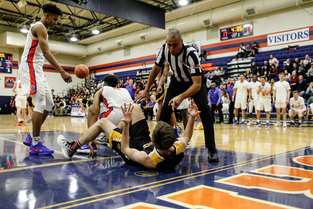 A referee calls a personal foul on Clark Chargers’ Adam Forbes (24) after he fouled Bi ...