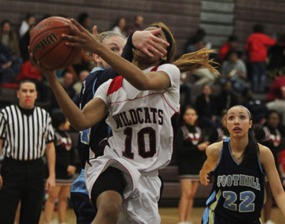 Las Vegas’ Shomari Harris (10) gets fouled by Foothill’s Gabby Doxtator while dr ...
