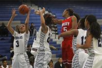Canyon Springs’ Cherise Beynon (3) grabs a rebound while taking on Valley on Tuesday.