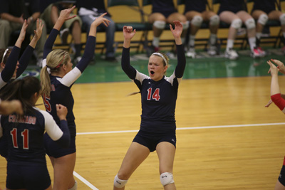 Coronado High School volleyball player Cali Thompson (14) celebrates with teammates after a ...