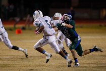 Canyon Spring High School’s Donnel Pumphrey (5) sprints as Green Valley’s Micah ...