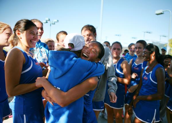 Bishop Gorman sophomore Amber Del Rosario, center, hugs senior teammate Julia MacDonald afte ...
