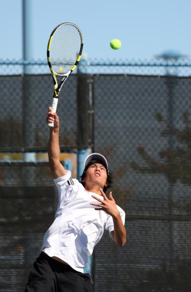 Clark junior Andrew Lim serves during a Division I-A state championship match against Trucke ...